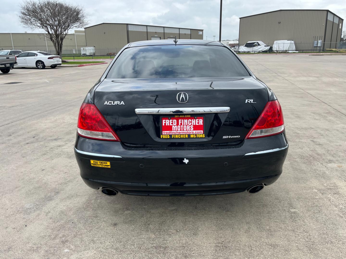 2005 Black /black Acura RL 3.5RL with Navigation System (JH4KB165X5C) with an 3.5L V6 SOHC 24V engine, 5-Speed Automatic Overdrive transmission, located at 14700 Tomball Parkway 249, Houston, TX, 77086, (281) 444-2200, 29.928619, -95.504074 - Photo#5